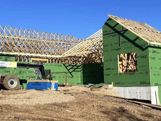 Professional roof truss installation by Lakeside Truss Company on a new Missouri build, featuring high-quality wooden trusses and ZIP System sheathing. This real-world photo demonstrates the precision and support we provide to contractors and builders across the state.